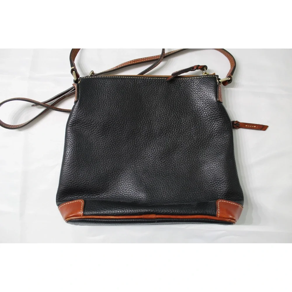 Dooney & Bourke Black Pebbled Leather Crossbody Bag with Tan Trim and Red Lining